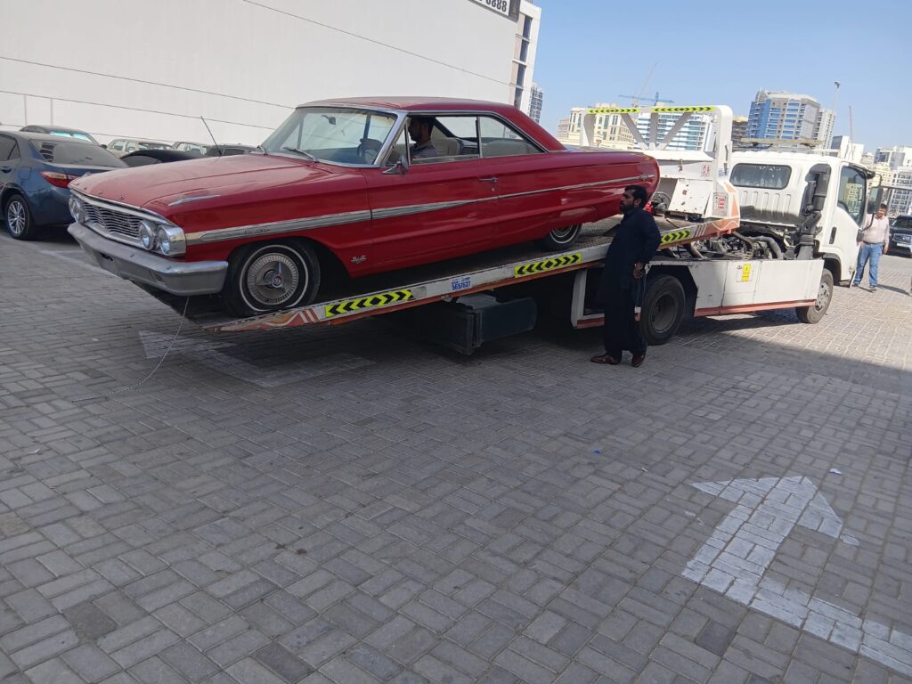 car recovery lifter is loaded with damaged car